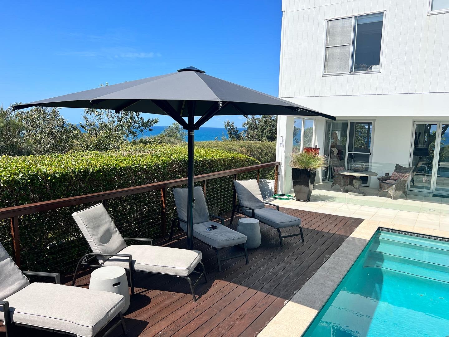 Ultrashade umbrella shading a Perth outdoor swimming pool