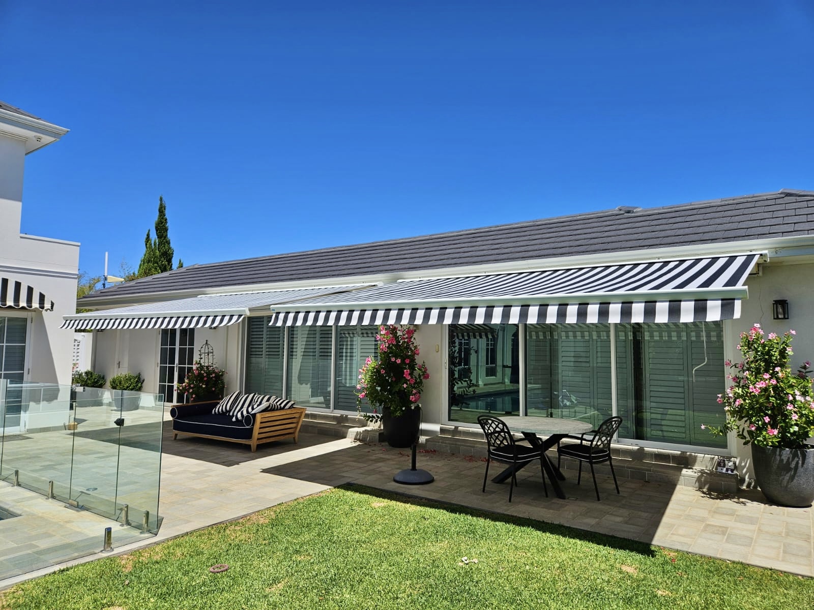 Retractable Folding arm awning fully extended over a Karrinyup home exterior