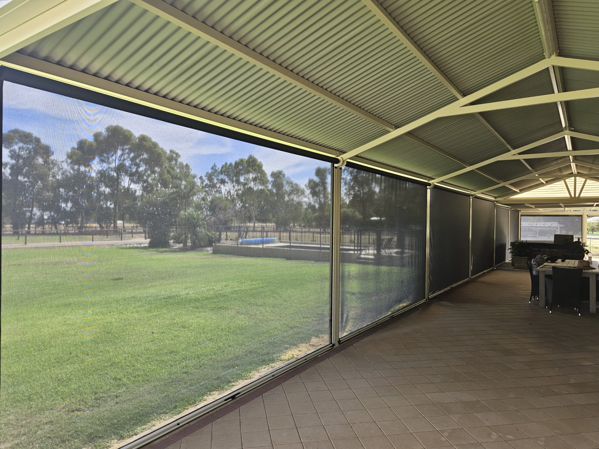 Mesh Ziptrak blinds enclosing verandah at acreage property in Oakford, Perth