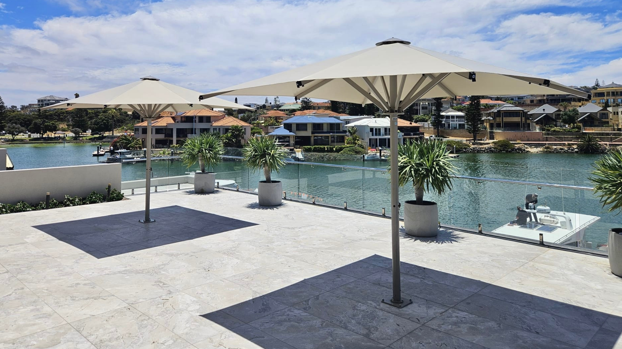 Ultrashade umbrellas in an outdoor area by the water