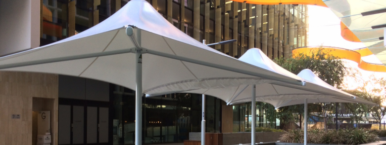 Commercial umbrella shade solution for an outdoor space