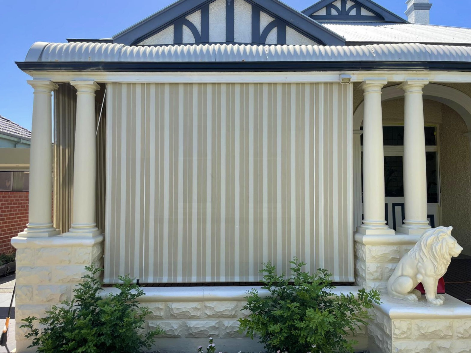 Cream striped outdoor blind on a traditional Federation-style Perth home, a heritage-friendly roller shutter alternative